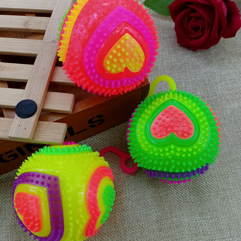 Glowing massage ball 7.5 cm bouncy ball flashing heart football with string and whistle piercing ball Glowing children 's toy