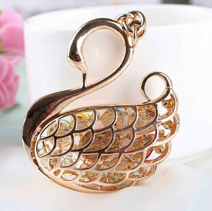 The cat's eye diamond key Koudian Swan drill key buckle alloy car hanging bag The cat's eye diamond key Koudian Swan drill key buckle alloy car hanging bag