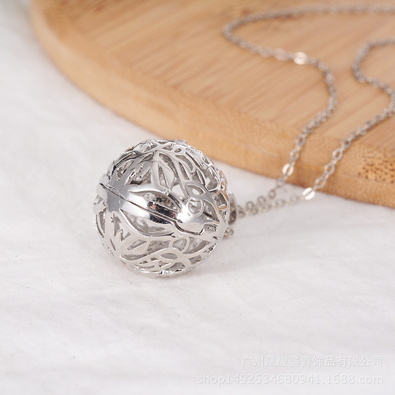 Female pregnant woman jingwen ball essence oil bottle invisible button hollow out flower magic box aroma phase box sweater necklace pendant