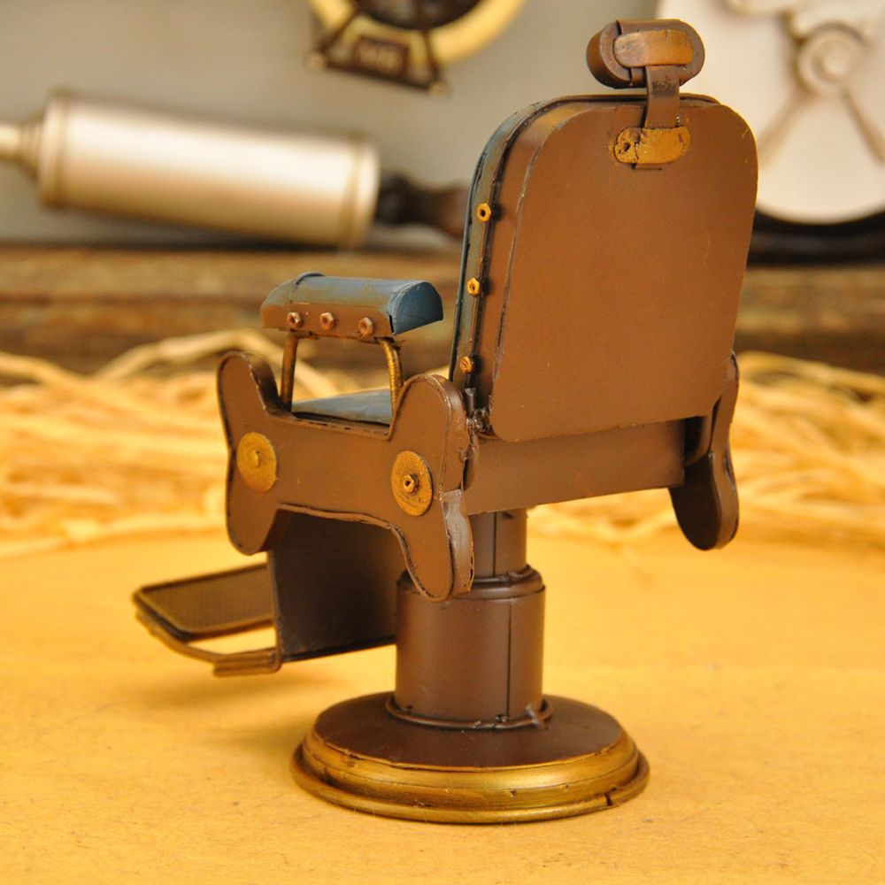 Vintage iron art for the cash register counter props creative tin American barbershop chairs small model crafts. Vintage iron art for the cash register counter props creative tin American barbershop chairs small model crafts.