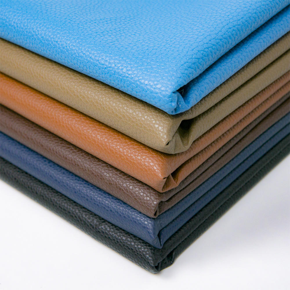 Factory in Stock Wholesale 0.7pu Large Litchi Leather Fabric Sofa Seat Cushion Bedside Soft Upholstery Background Wall Artificial Leather