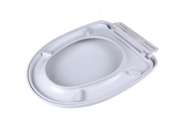 Slow descenting plastic toilet lid
