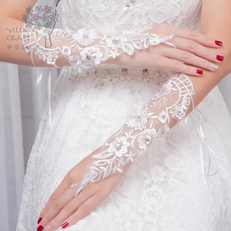 Han edition bride&#039;s gloves short and long wedding dress lace gloves white spring summer sun protection gloves.