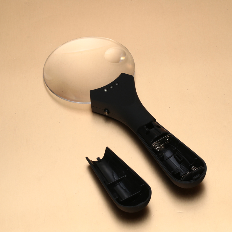 Hand-held magnifier with light diffuser with compass elderly elderly and children reading magnifier