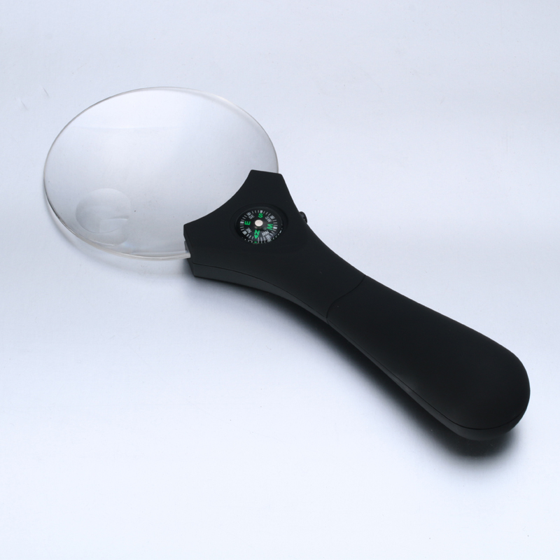 Hand-held magnifier with light diffuser with compass elderly elderly and children reading magnifier
