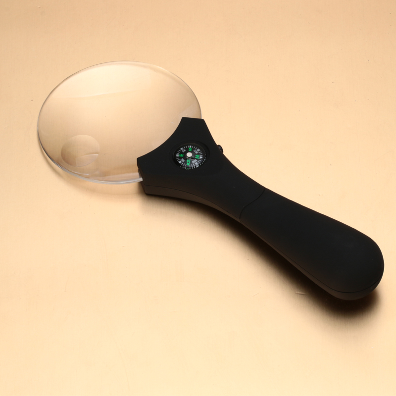 Hand-held magnifier with light diffuser with compass elderly elderly and children reading magnifier