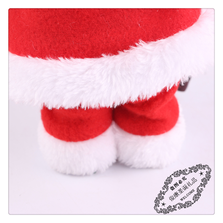 Santa Claus holds a walking stick as a Christmas ornament Santa Claus holds a walking stick as a Christmas ornament
