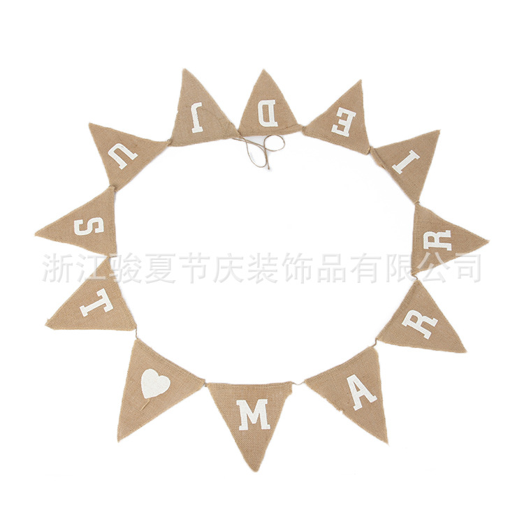 Holiday party decoration: a wedding flag with a linen triangle on the hem Holiday party decoration: a wedding flag with a linen triangle on the hem