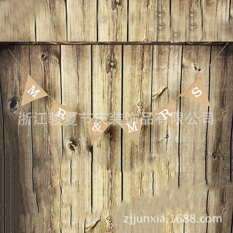 Holiday party decoration: a wedding flag with a linen triangle on the hem Holiday party decoration: a wedding flag with a linen triangle on the hem